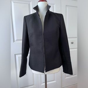 Casual Corner front zippered black jacket with zippered sleeves.
